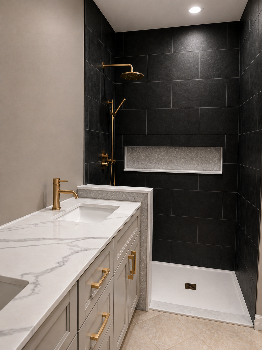 Black slate-look shower tile with a pebble mosaic niche and white shower base