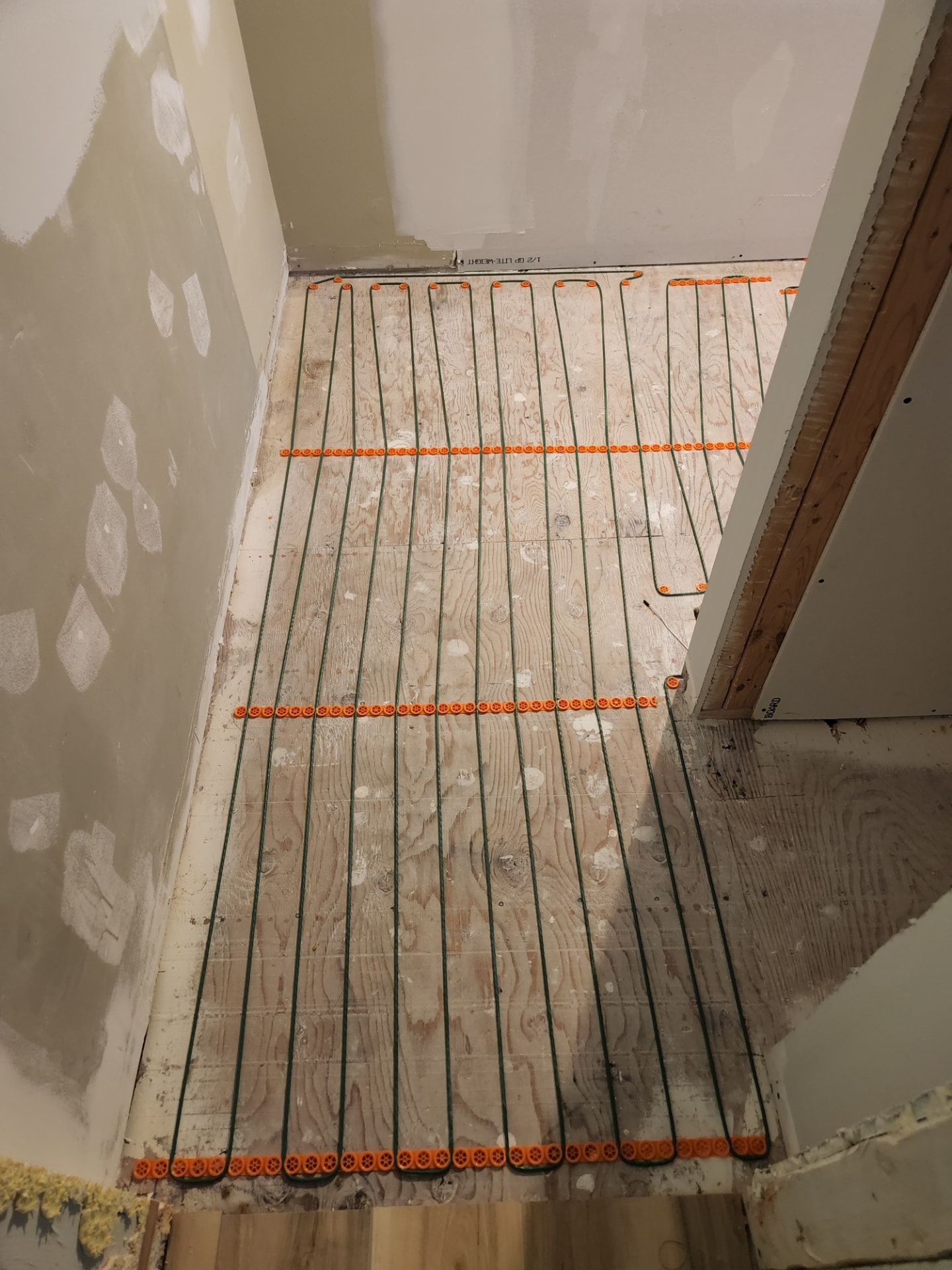 Second view of the in-floor heating cable run through to the doorway