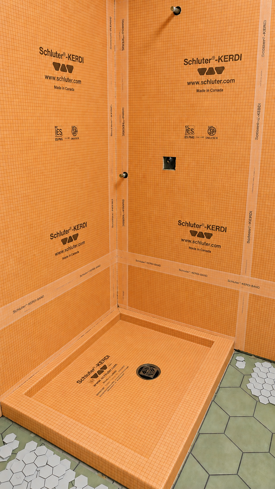 Shower walls and curbed base fully waterproofed with Kerdi membrane and banded seams