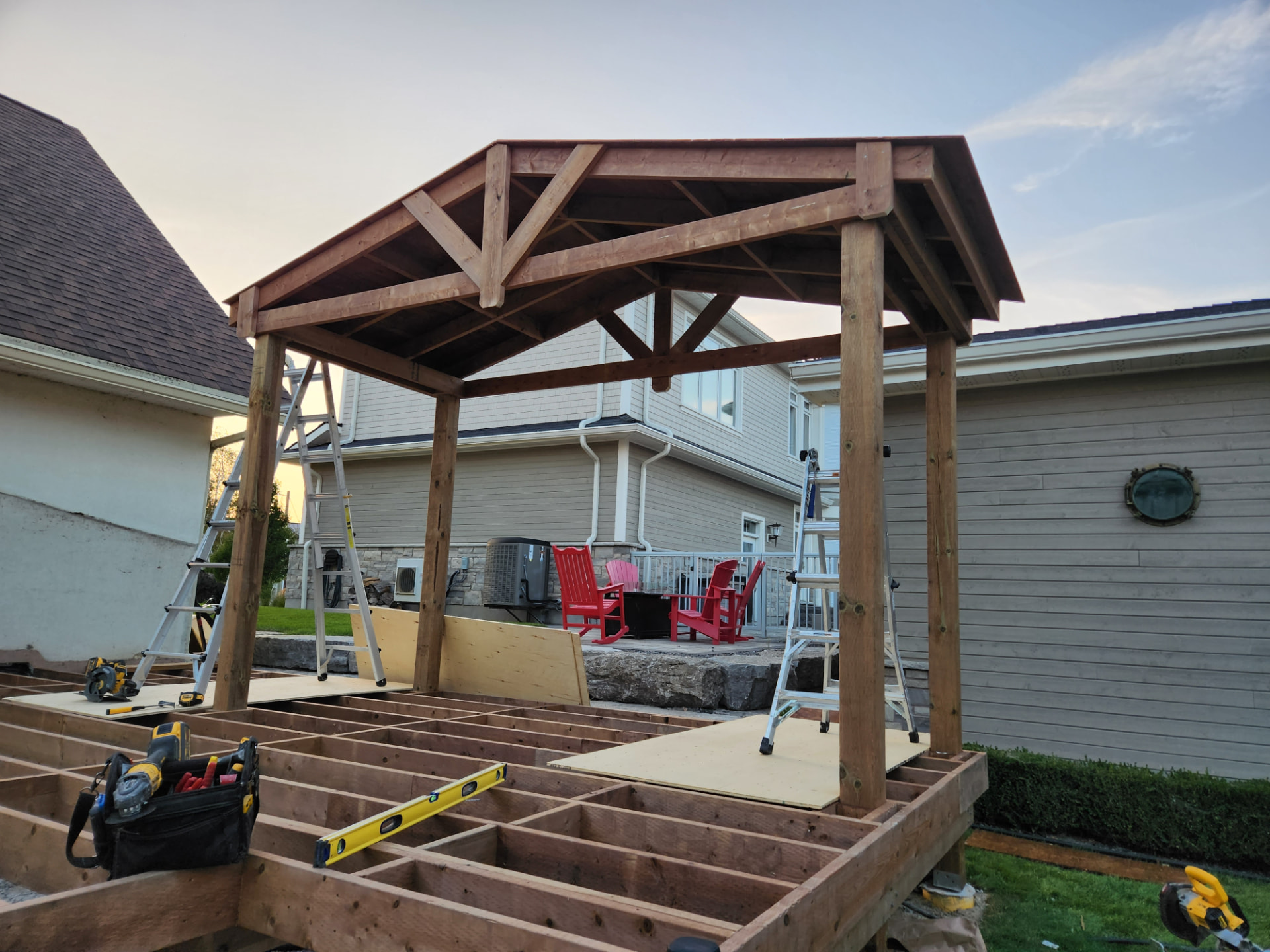 Timber pavilion roof framed above the new deck structure